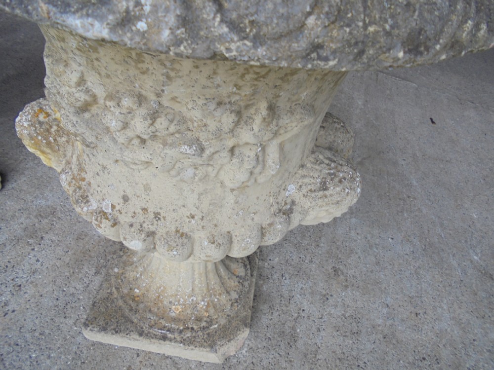 Pair well weathered stone garden urns View II
