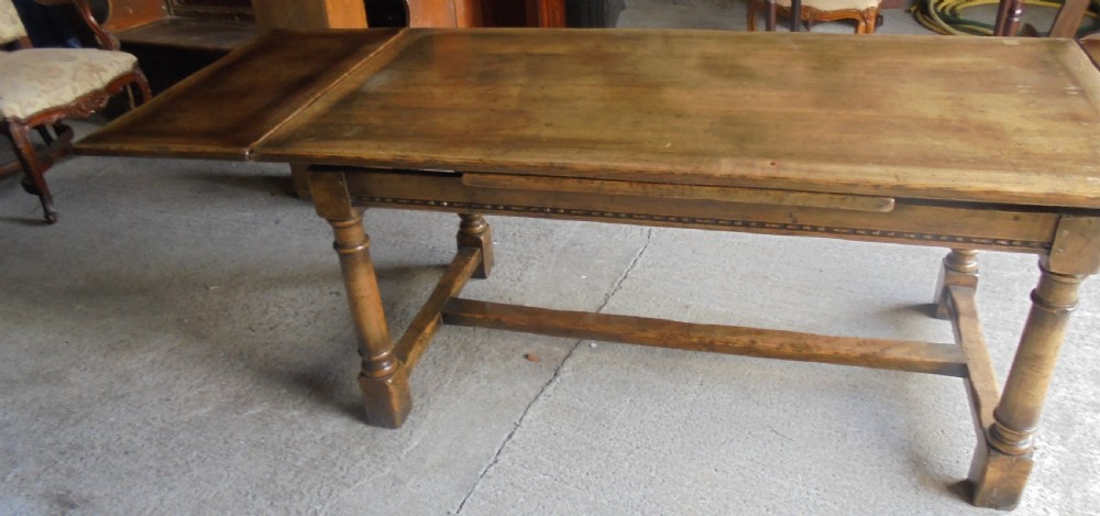 19th century pale oak extending refectory dining table Seats ten View V