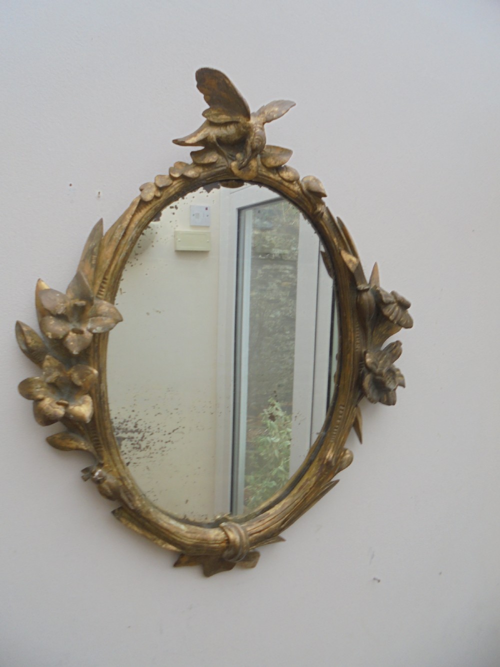 18th century oval gilded wood  wall mirror