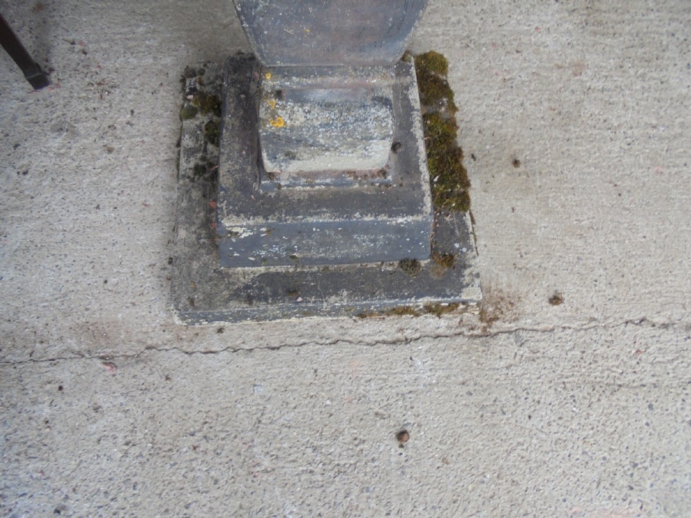 Sun dial on well weathered stand  View III