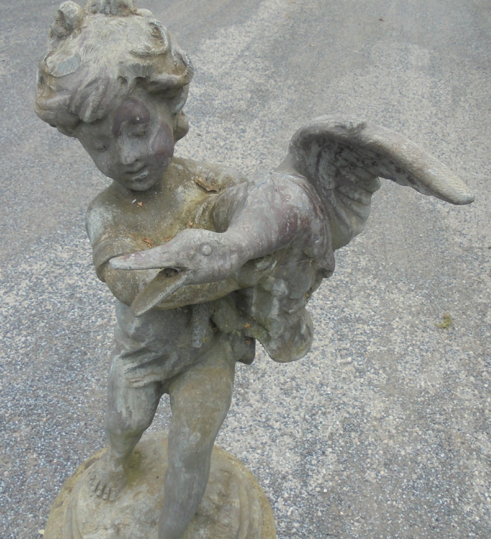 Delightful lead fountain of boy and goose on well weathered stand View III