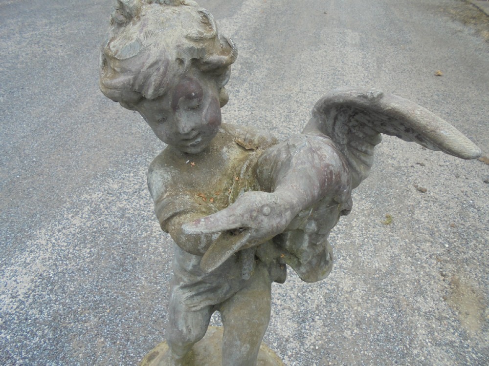 Delightful lead fountain of boy and goose on well weathered stand View V