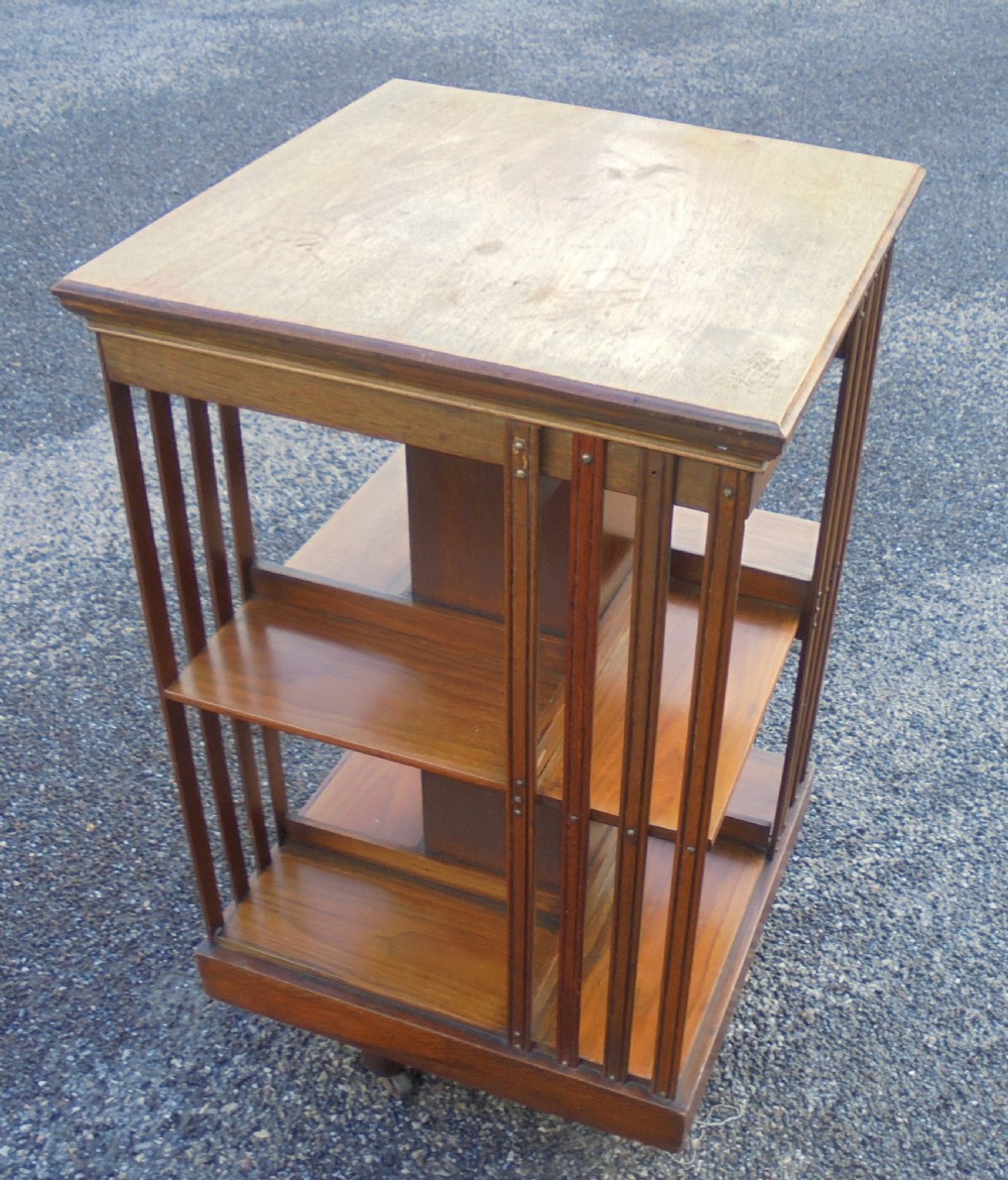 Walnut two tier revolving bookcase