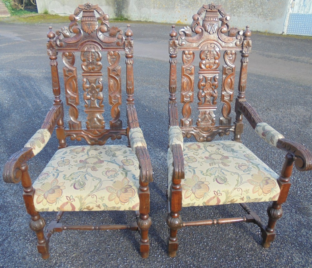 Pair oak heavily carved large armchairs