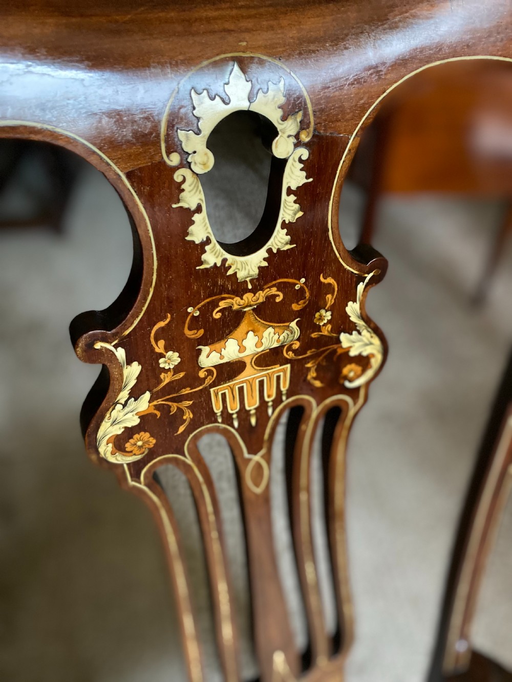 A high-back mahogany armchair featuring detailed marquetry inlay on the splat and arms with an upholstered seat. View II