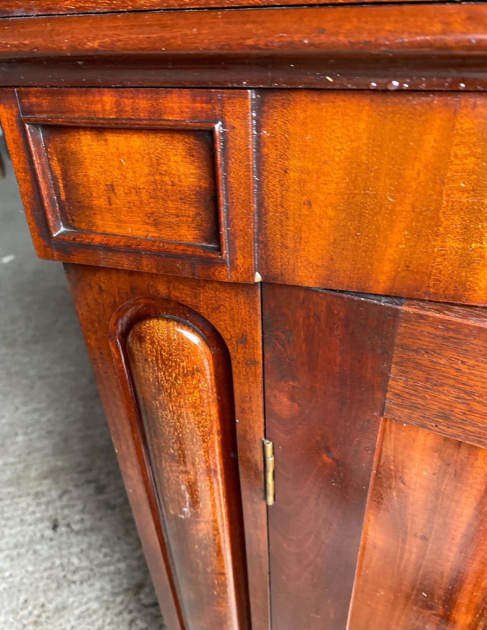 A nineteenth-century mahogany linen press cupboard featuring two panelled doors, recessed side panels, and a moulded top cornice. View VII
