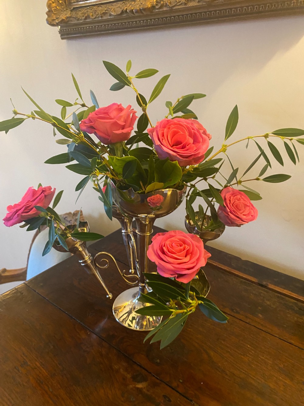 A silver-plated five-trumpet table epergne featuring a central tall trumpet vase surrounded by four smaller branching fluted vases on scroll arms. View II