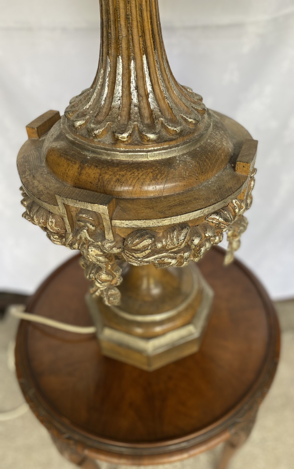 A tall carved walnut table lamp featuring an architectural column design with an Ionic capital, fluted shaft, carved urn base, and gold leaf highlights. View III