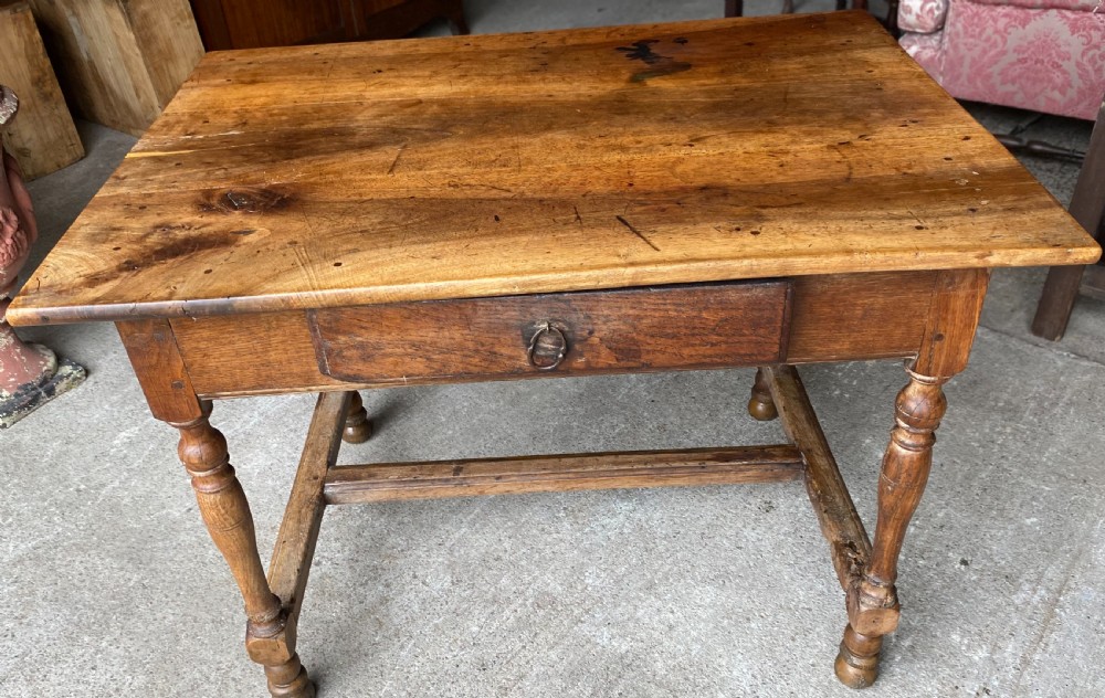 An 18th-century French fruitwood occasional table featuring a rectangular top, single drawer with an iron ring handle, turned legs, and a low stretcher base. View II