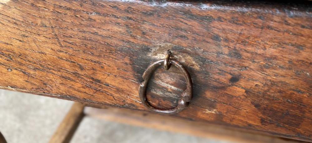 An 18th-century French fruitwood occasional table featuring a rectangular top, single drawer with an iron ring handle, turned legs, and a low stretcher base. View IV