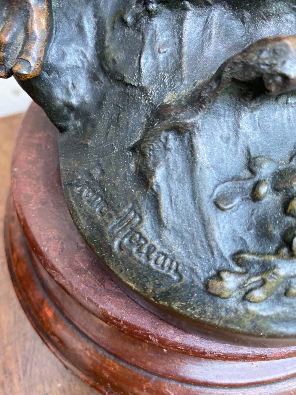 A pair of patinated spelter figures depicting a fisherwoman holding a basket and a fisherman carrying nets, mounted on circular turned wood bases with brass title plates. View VIII