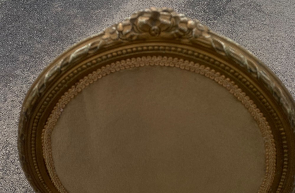 A set of four 19th-century French Louis XVI style side chairs featuring carved gilded wooden frames with oval medallion backs and beige velvet upholstery. View II