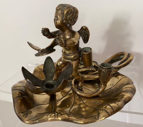 Brass Chamber Stick in the Form of a Cherub. 19th Century