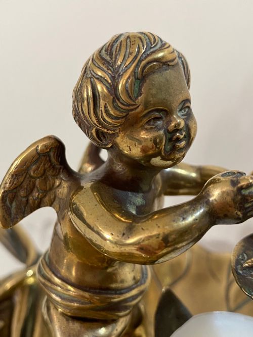 fig 1. Brass Chamber Stick in the Form of a Cherub. 19th Century
