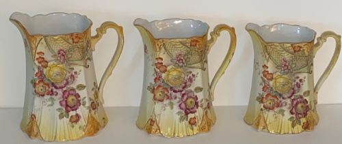 Three Graduated Antique Jugs.