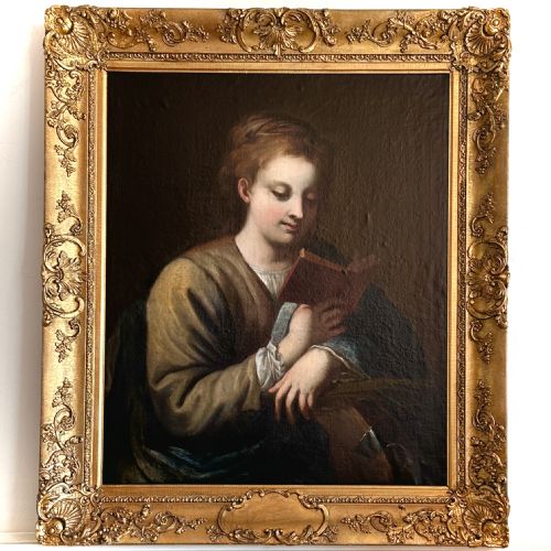 fig 1. An 18th-century Italian oil painting on canvas depicting Saint Catherine reading a book, set within an ornate gilded carved frame.