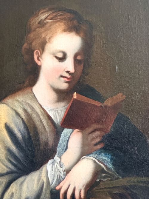 fig 3. An 18th-century Italian oil painting on canvas depicting Saint Catherine reading a book, set within an ornate gilded carved frame.