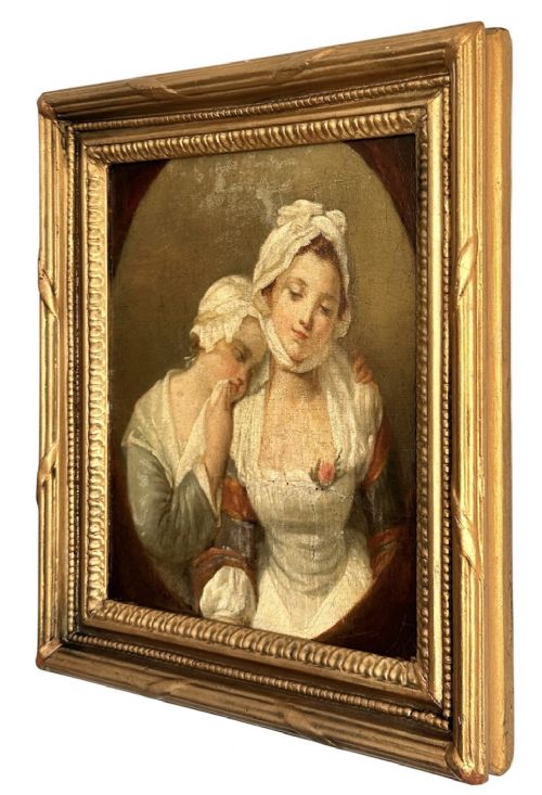An 18th-century oil painting on canvas depicting two women in period costume within an oval painted border, housed in a carved gilded frame. View VII