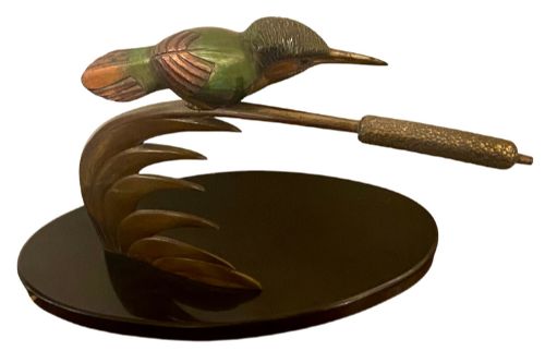 fig 2. An Art Deco cold-painted bronze sculpture depicting a stylized kingfisher perched on swept curved reeds, set upon an oval dark marble base.