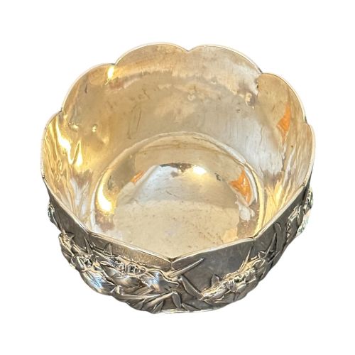 fig 1. An antique Japanese silver bowl featuring high-relief repousse iris motifs and a scalloped lobed rim.