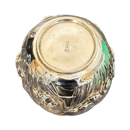 fig 2. An antique Japanese silver bowl featuring high-relief repousse iris motifs and a scalloped lobed rim.