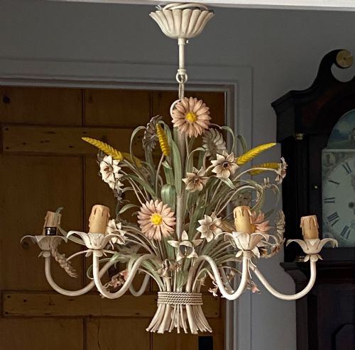 fig 1. A pair of Italian painted metal toleware chandeliers featuring branching candle arms surrounded by sculpted painted foliage, wheat sheaves, and flowers.