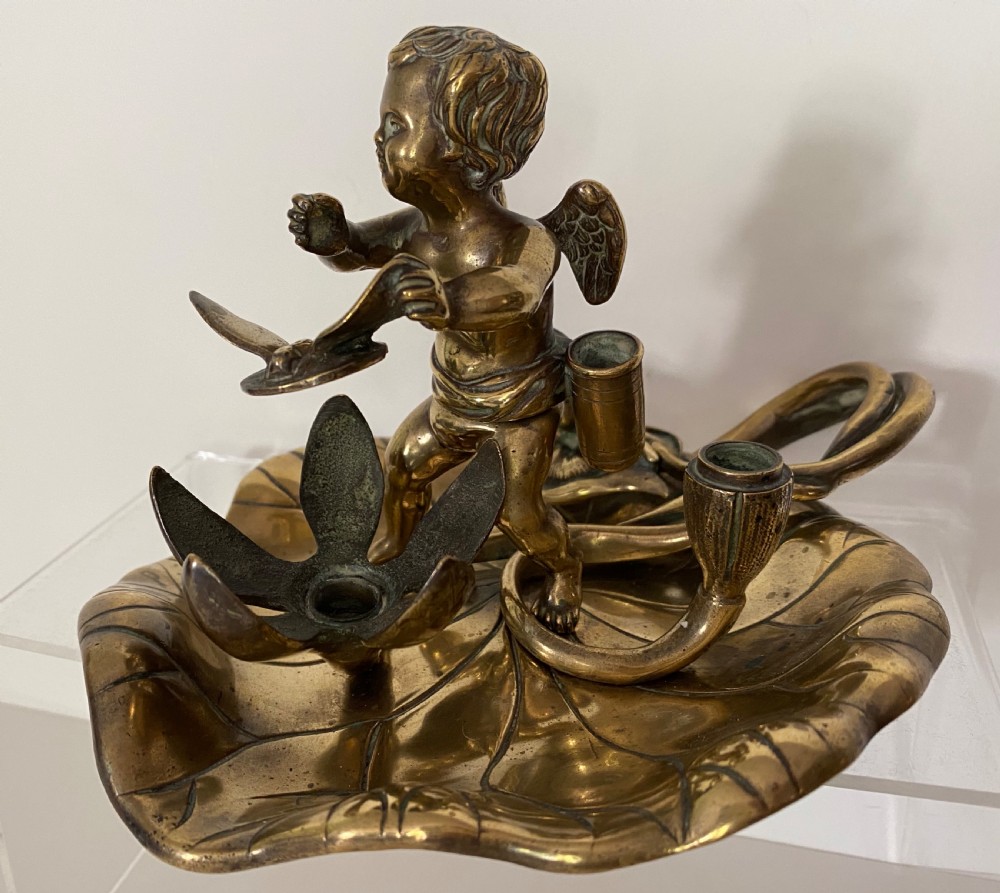 Brass Chamber Stick in the Form of a Cherub. 19th Century