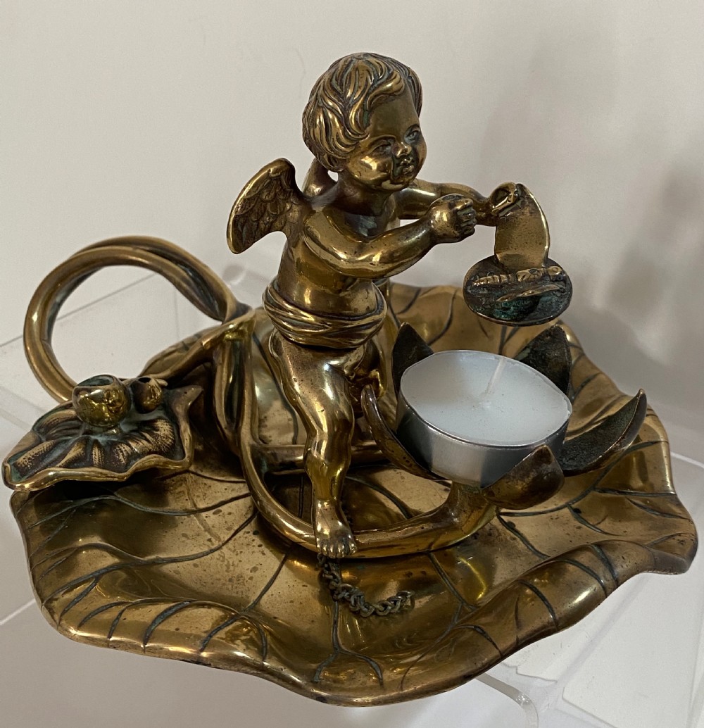 Brass Chamber Stick in the Form of a Cherub. 19th Century View III