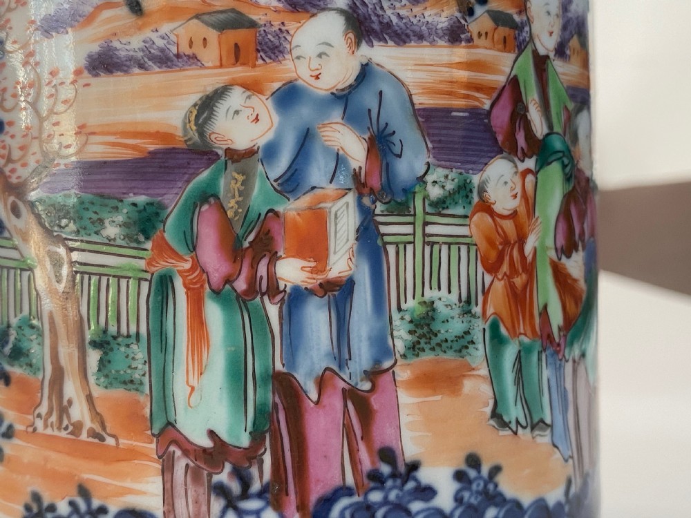 An 18th-century cylindrical Chinese export porcelain tankard decorated with Mandarin figures, panels of birds, iron-red lattice background, and a sculpted blue dragon handle. View VII