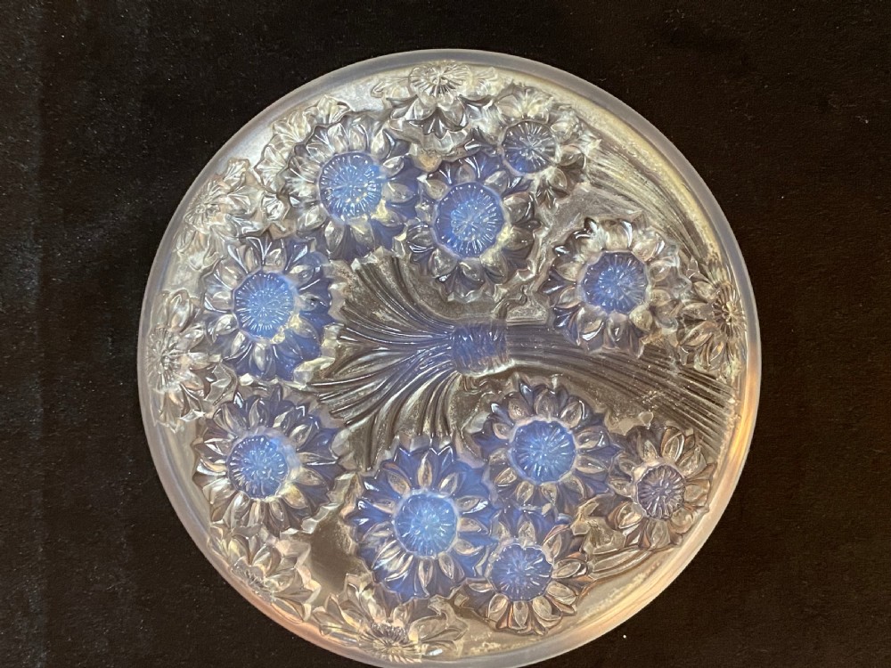 A circular French Art Deco opalescent glass box and cover with a raised moulded floral motif. View III