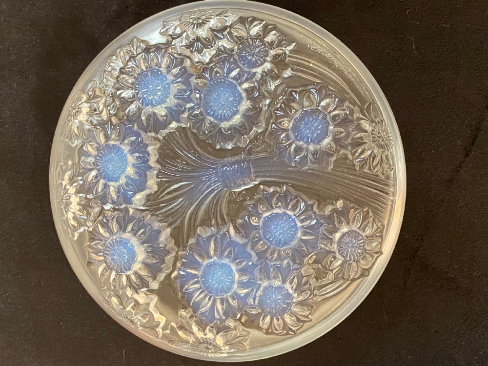 A circular French Art Deco opalescent glass box and cover with a raised moulded floral motif. View VI