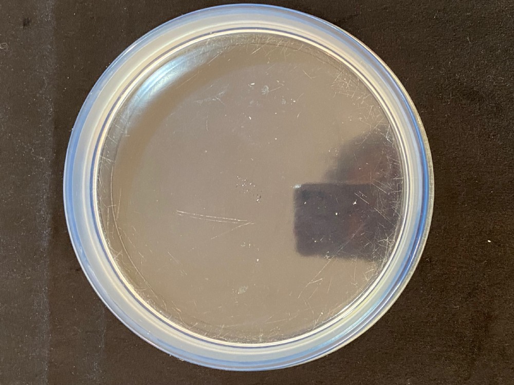 A circular French Art Deco opalescent glass box and cover with a raised moulded floral motif. View VIII