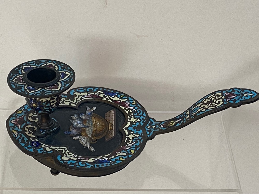 An antique metal chamberstick decorated with turquoise cloisonne enamel scrollwork surrounding a central micromosaic panel of birds drinking from a bowl. View II