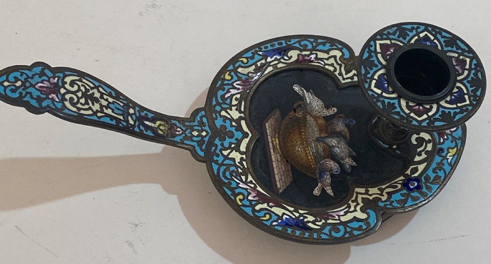 An antique metal chamberstick decorated with turquoise cloisonne enamel scrollwork surrounding a central micromosaic panel of birds drinking from a bowl. View III