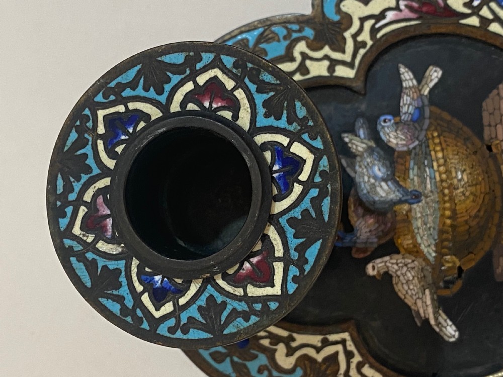 An antique metal chamberstick decorated with turquoise cloisonne enamel scrollwork surrounding a central micromosaic panel of birds drinking from a bowl. View VII