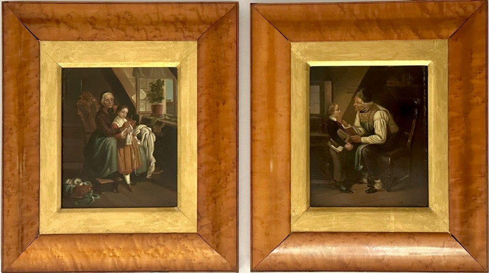 A pair of framed 19th-century oil paintings on tin depicting domestic interior genre scenes, mounted within broad maple veneer frames with gilded inner slips.