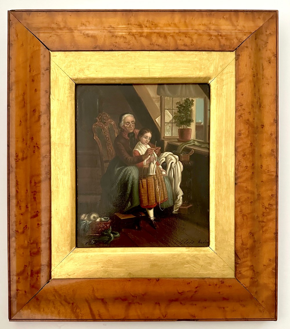 A pair of framed 19th-century oil paintings on tin depicting domestic interior genre scenes, mounted within broad maple veneer frames with gilded inner slips. View III