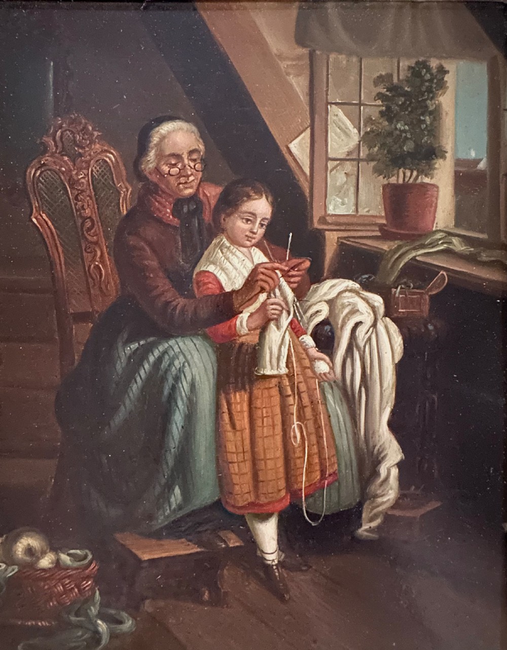 A pair of framed 19th-century oil paintings on tin depicting domestic interior genre scenes, mounted within broad maple veneer frames with gilded inner slips. View V