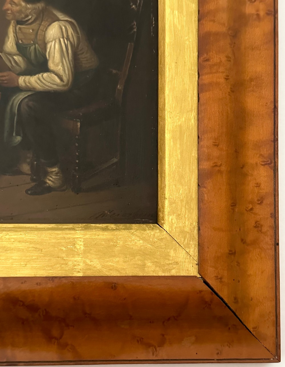 A pair of framed 19th-century oil paintings on tin depicting domestic interior genre scenes, mounted within broad maple veneer frames with gilded inner slips. View VIII