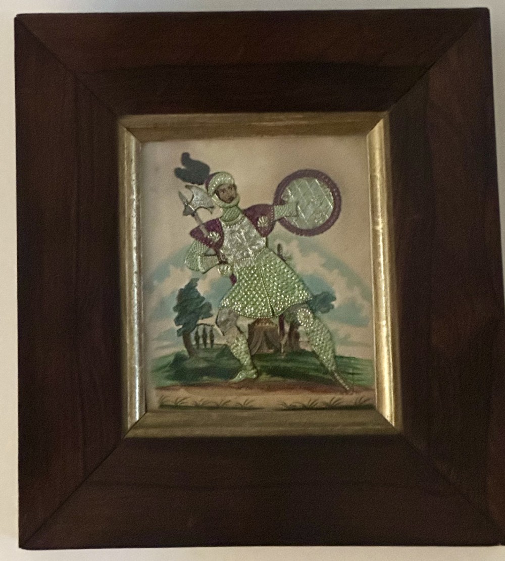 A pair of framed Regency theatrical tinsel pictures depicting armoured figures with weapons set inside dark wood frames with gold slips. View III