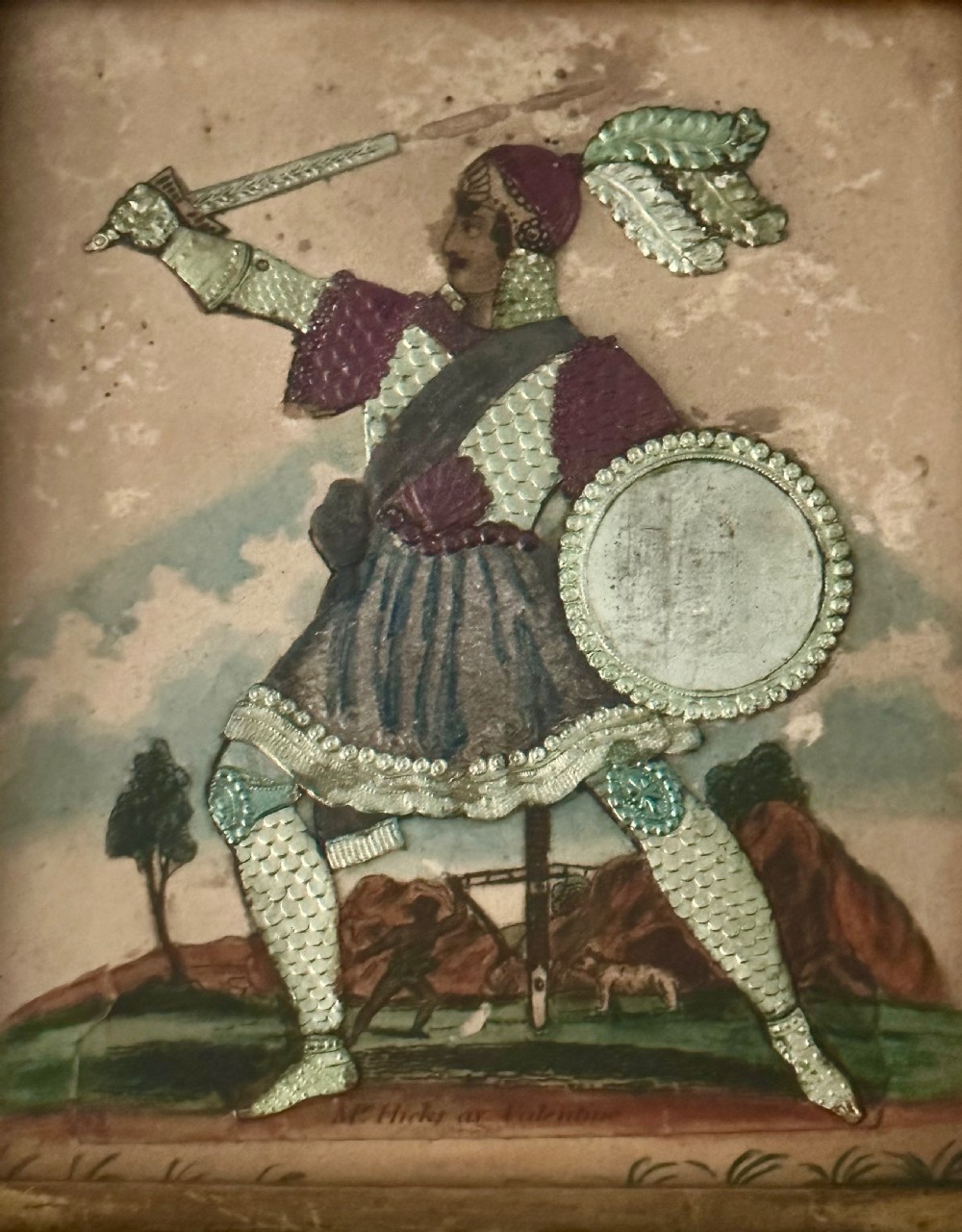 A pair of framed Regency theatrical tinsel pictures depicting armoured figures with weapons set inside dark wood frames with gold slips. View IV