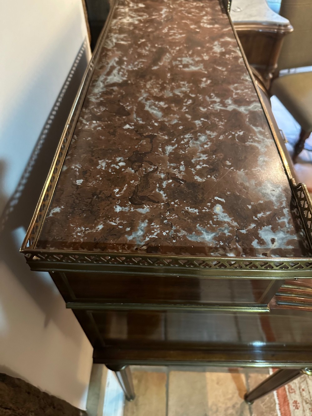 A mahogany French cylinder escritoire featuring a central painted pastoral scene on the roll-top, upper drawer tier, brass mounts, and slender fluted legs. View XV