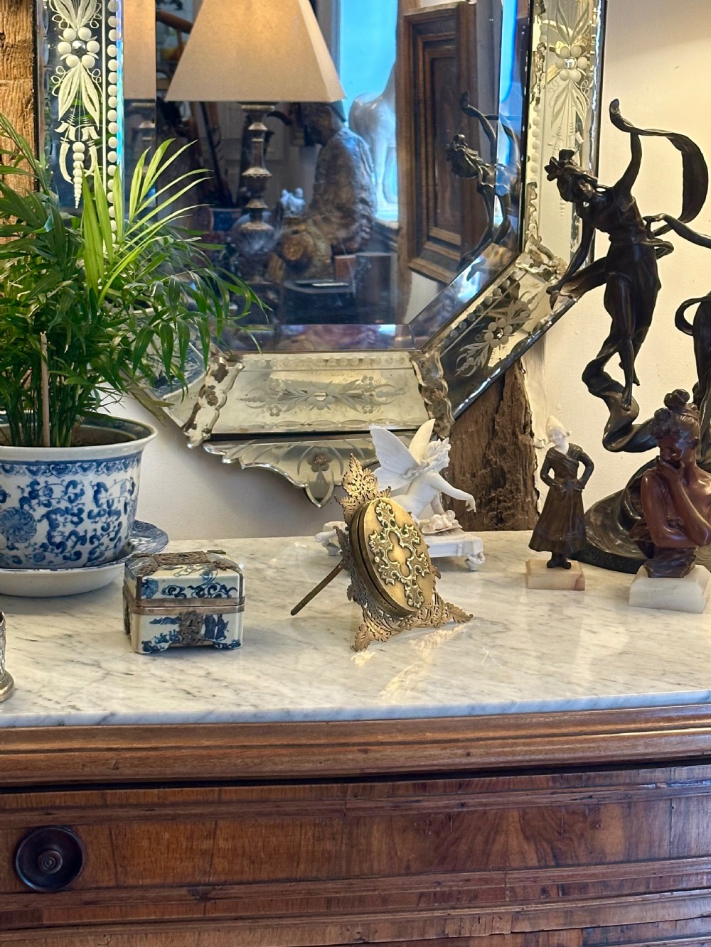 An ornate Victorian brass double picture frame featuring two oval apertures framed by detailed foliate metalwork and an easel stand. View VIII