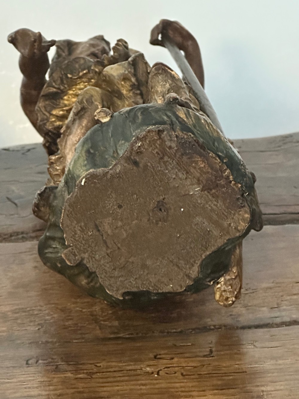 A 17th-century parcel-gilded bronze figure depicting Saint John the Baptist with a staff and lamb, standing on a rectangular wood plinth base. View VII