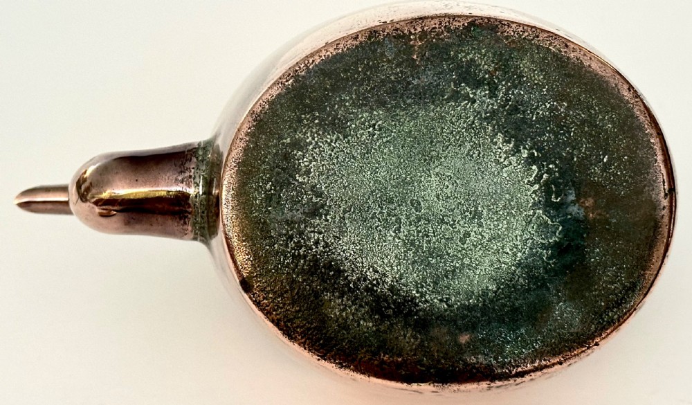 An antique copper tea kettle featuring a gooseneck spout, stationary overhead handle, and fitted lid with a central finial. View VIII