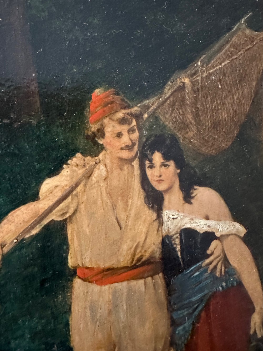 A pair of vertical oil paintings on wooden panels depicting rural couples, framed in dark oak moulding with gilt inner slips. View IV