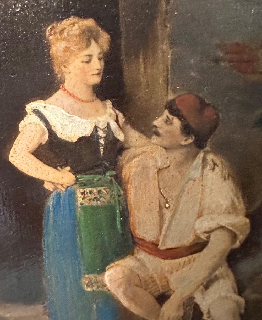 A pair of vertical oil paintings on wooden panels depicting rural couples, framed in dark oak moulding with gilt inner slips. View VII