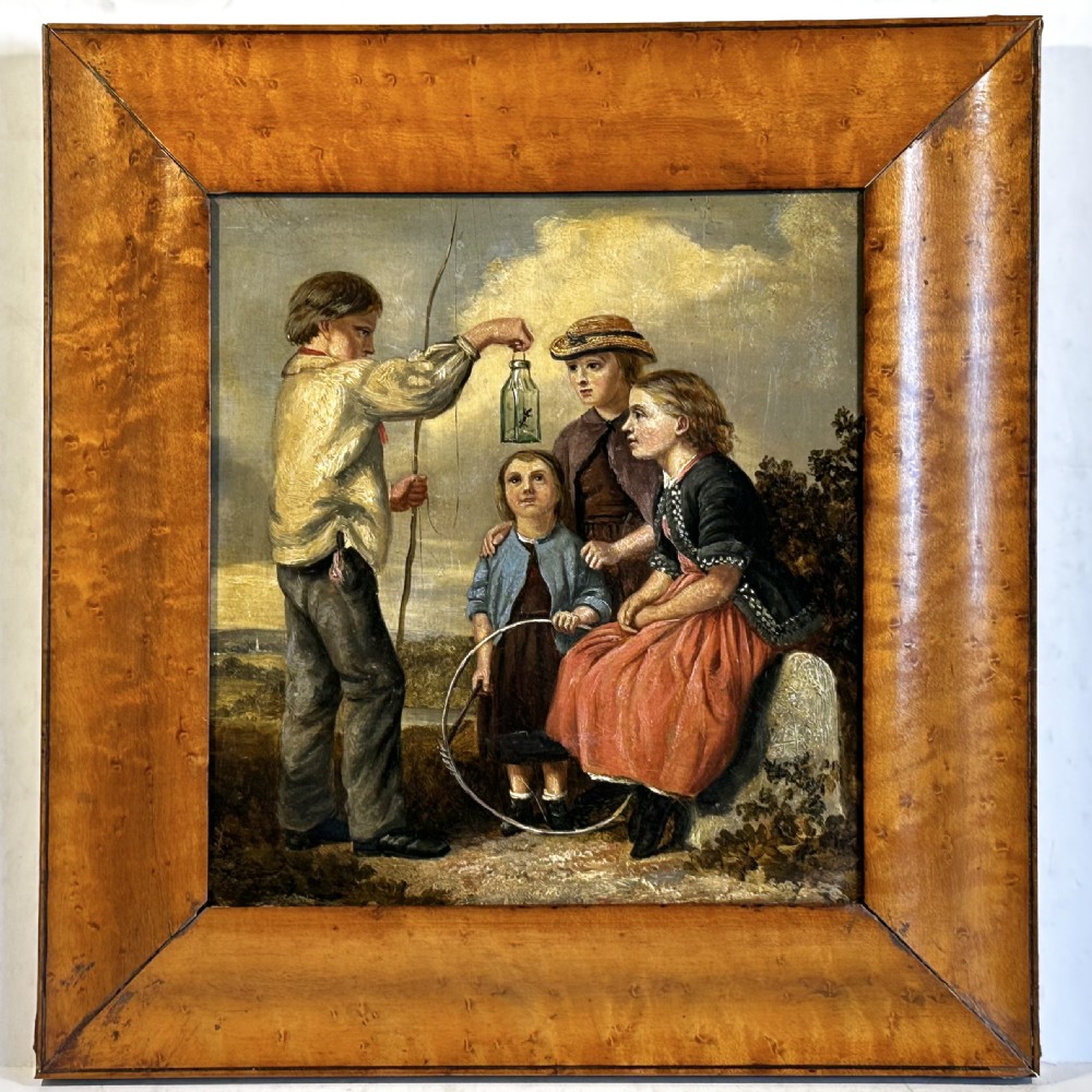 A 19th-century Victorian oil painting on panel depicting four children outdoors, framed in a wide burr maple timber frame.