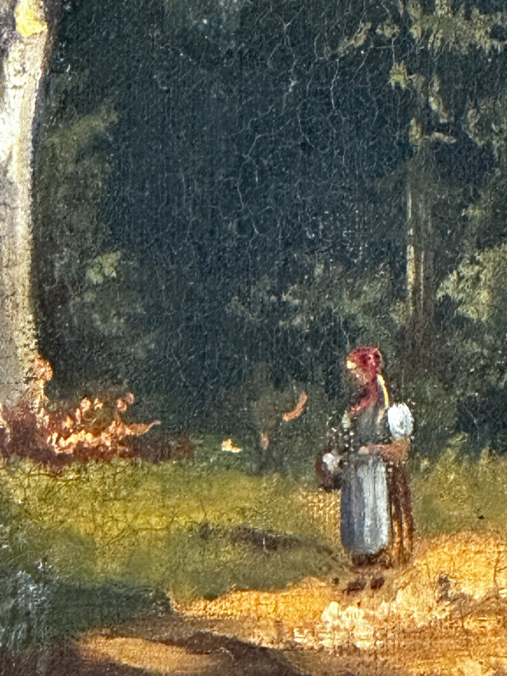 An antique oil painting on canvas depicting a sunlit woodland path with tall green trees and a small figure, set within an ornate gilded frame. View IV