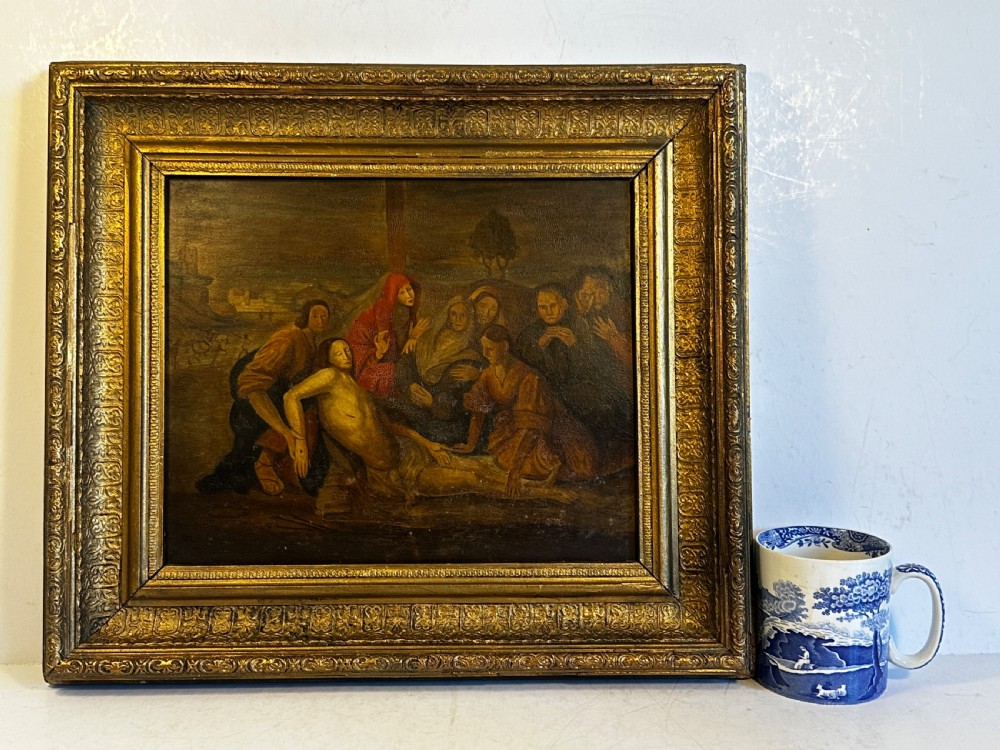 An eighteenth-century Italian oil painting on wood panel depicting the Lamentation of Christ, housed in an ornate carved and gilded frame. View VIII